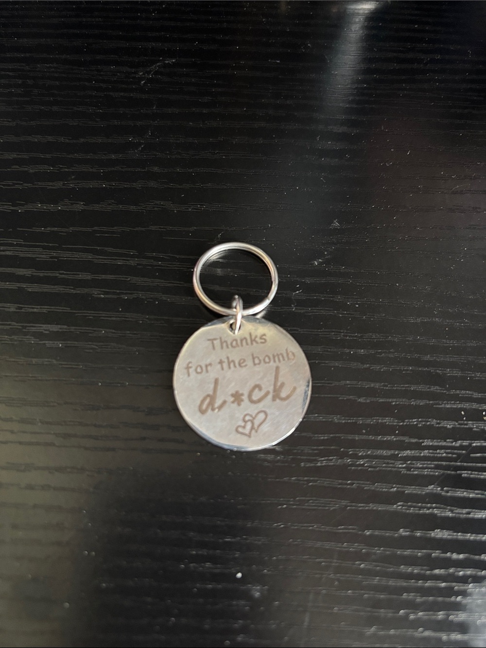 Engraved Round Silver-tone Keychain - "Thanks for the bomb d*ck"